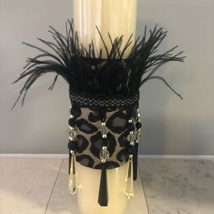 Candle wrap with long beaded tassel trim.